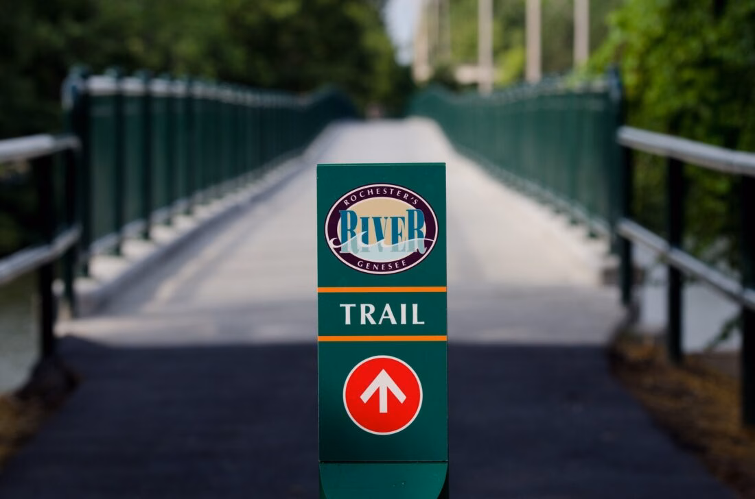 Green sign by the Erie Lackawanna Railroad Bridge over the Genesee River.