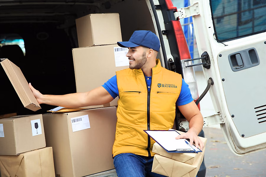 Mail courier delivering campus packages.