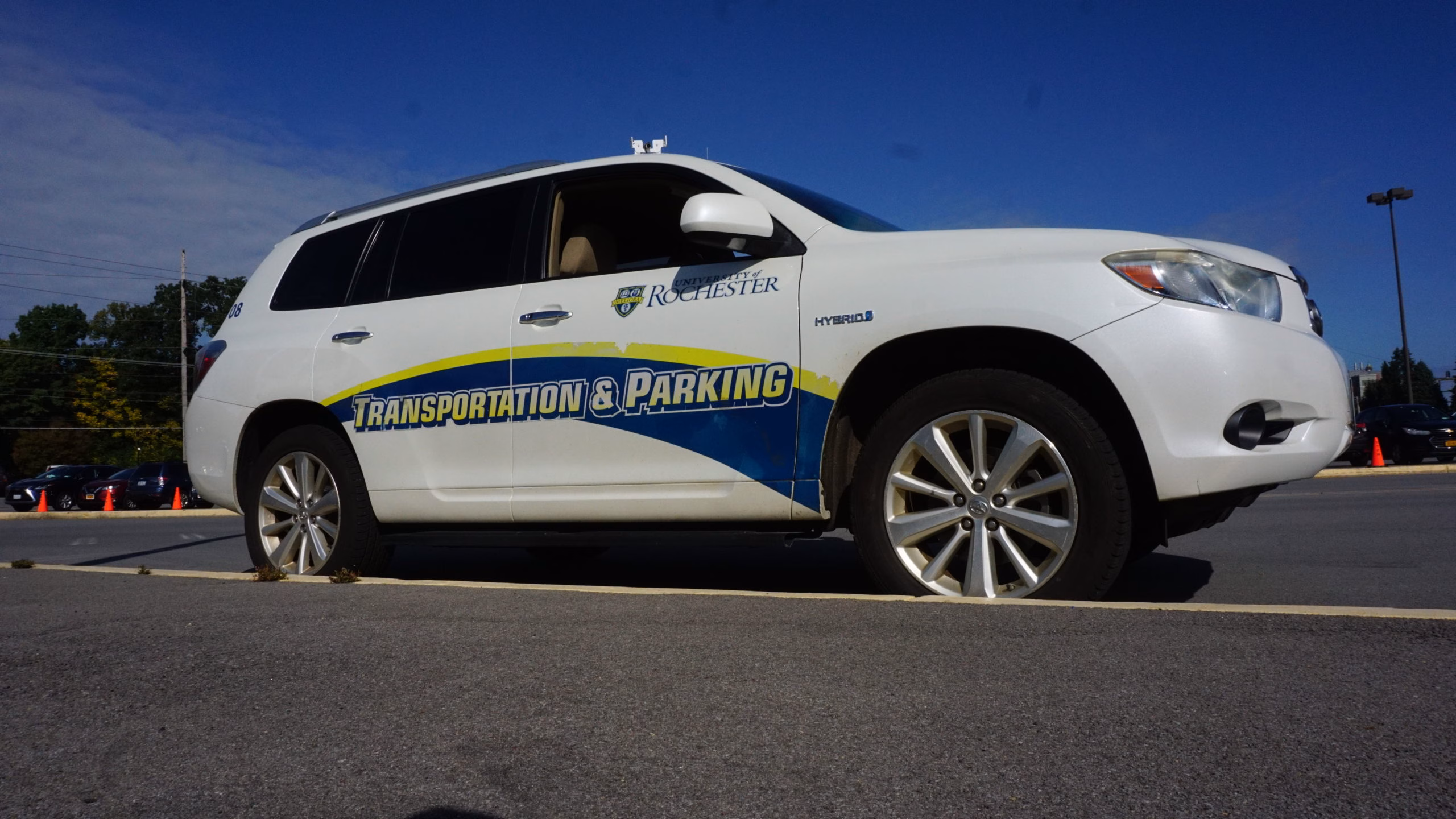 Transportation and Parking SUV parked in campus lot.